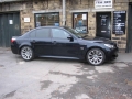 BMW M5. Headrest screens fitted onto Active Airbag headrest maintaining full fuctioning of airbag units. 2 single play DVD players installed into boot compartment allowing 2 different movies to watched on each screen.