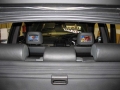 BMW X5. 2 Heasdrest screens trimmed into original headrest. Sony Playstation 2 with cordless controllers and remote reset. 6 disc DVD changer boot mounted with remote.