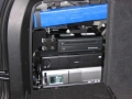 BMW X5. 2 Heasdrest screens trimmed into original headrest. Sony Playstation 2 with cordless controllers and remote reset. 6 disc DVD changer boot mounted with remote.