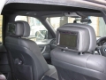 BMW X5. Two Screens fitted to standard active headrest with airbag function undisturbed. 6 Disc DVD changer fitted into boot compartment, remotely controlled.