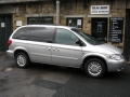 Chrysler Voyager. Roof Screen DVD Combo installed with cordless headphones