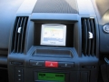 Land Rover Freelander 2. Tomtom One installed to spare cubby hole in dash as per original equipment.