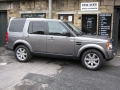 Land Rover Discovery 3. Fitted with screens trimmed into original headrest and 6 disc DVD player installed into standard location in boot area.