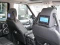 Land Rover Discovery 3. Fitted with screens trimmed into original headrest and 6 disc DVD player installed into standard location in boot area.