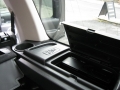 Land Rover Discovery 3. Fitted with screens trimmed into original headrest and 6 disc DVD player installed into standard location in boot area.