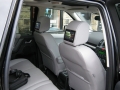 Land Rover Freelander 2. Fitted with screens trimed into original headrest. Single disc DVD installed under front seat. Cordless headphones.