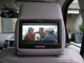 Land Rover Freelander 2. Fitted with screens trimed into original headrest. Single disc DVD installed under front seat. Cordless headphones.