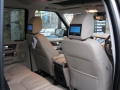 Landrover Dicovery 4. Two Screens trimmed into standard headrests. 6 Disc DVD player installed into standard location in boot. 2 cordless headphones.