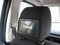 Land Rover Freelander 2. Two screens trimmed into standard headrest. Single DVD player installed under passenger seat allowing access from front. Cordless headphones.