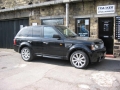 Range Rover Sport. Two Screens trimmed into headrests. Single disc DVD player installed into rear of centre console. Cordless Headphones.