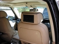 Range Rover Vogue. Two screens trimmed into standard headrests on comfort seats. 6 disc DVD changer fitted into boot. DVD player wired into front standard front screen and configured to allow dispaly to stay on while on the go.
