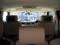 Range Rover Vogue. Two screens trimmed into standard headrests on comfort seats. 6 disc DVD changer fitted into boot. DVD player wired into front standard front screen and configured to allow dispaly to stay on while on the go.