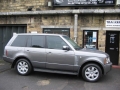 Range Rover Vogue. Two Screens trimmed into headrests. 6 disc disc DVD player installed into boot compartment in standard location. Sony Playstation 2 installed into compartment for factory DVD Changer (not fitted) .Cordless Headphones.
