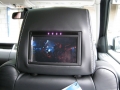 Range Rover Sport 2010. Screens trimmed into original headrests. 6 Disc DVD changer install to standard location. Cordless Headphones.