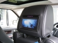 Range Rover Sport 2010. Screens trimmed into original headrests. 6 Disc DVD changer install to standard location. Cordless Headphones.