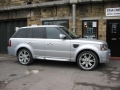 Range Rover Sport. Two Screens trimmed into headrests. Single disc DVD player installed into rear of centre console. Sony Playstation 2 installed into compartment for factory DVD Changer (not fitted) .Cordless Headphones.