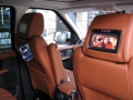Range Rover Sport 2010. Screens trimmed into original headrests. 6 Disc DVD changer install to standard location. Slimline Sony PS3 console installed in boot. Cordless Headphones.