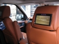 Range Rover Sport 2010. Screens trimmed into original headrests. 6 Disc DVD changer install to standard location. Slimline Sony PS3 console installed in boot. Cordless Headphones.
