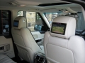 Range Rover Vouge 2010. Screens trimmed into original headrests. 6 Disc DVD changer install to standard location. Facory installed Digital TV image wired to rear headrest screens Cordless Headphones.