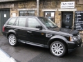 Range Rover Sport 2011. 2, 60Hz Screens trimmed into standard headrets. xBox 360 installed into boot in custom made mounting. 6 Disc DVD changer installed into standard location behind left boot trim.